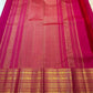 Rani Pink pure silk Kanjivaram Varisaipet saree with spaced antique-gold zari buttas and layered gold border.