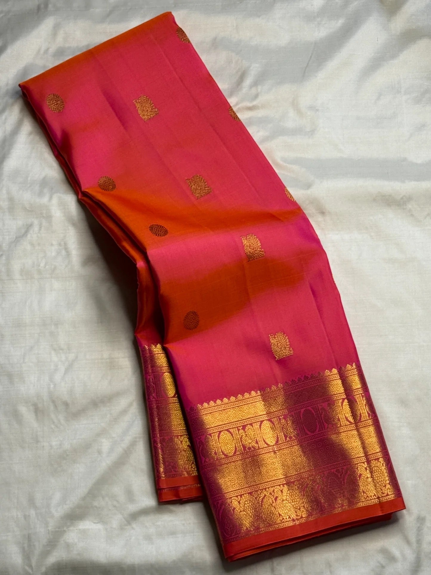 Rani Pink and Vermilion Orange Shot-Colour Handwoven Pure Silk Kanchipuram Saree with Gold Zari Buttas