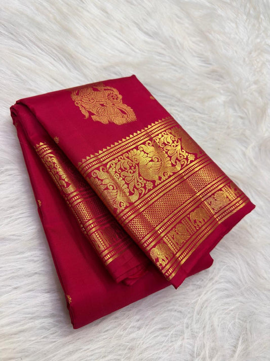 Sindoor Red pure silk Kanchipuram saree with traditional ornate zari border.