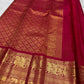 Sindoor Red pure silk Kanjivaram Butta saree with ornate antique-gold Yazhi border.