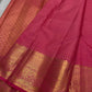 Handwoven pink Kanchipuram Zari Kattam saree with small antique-gold zari motifs.