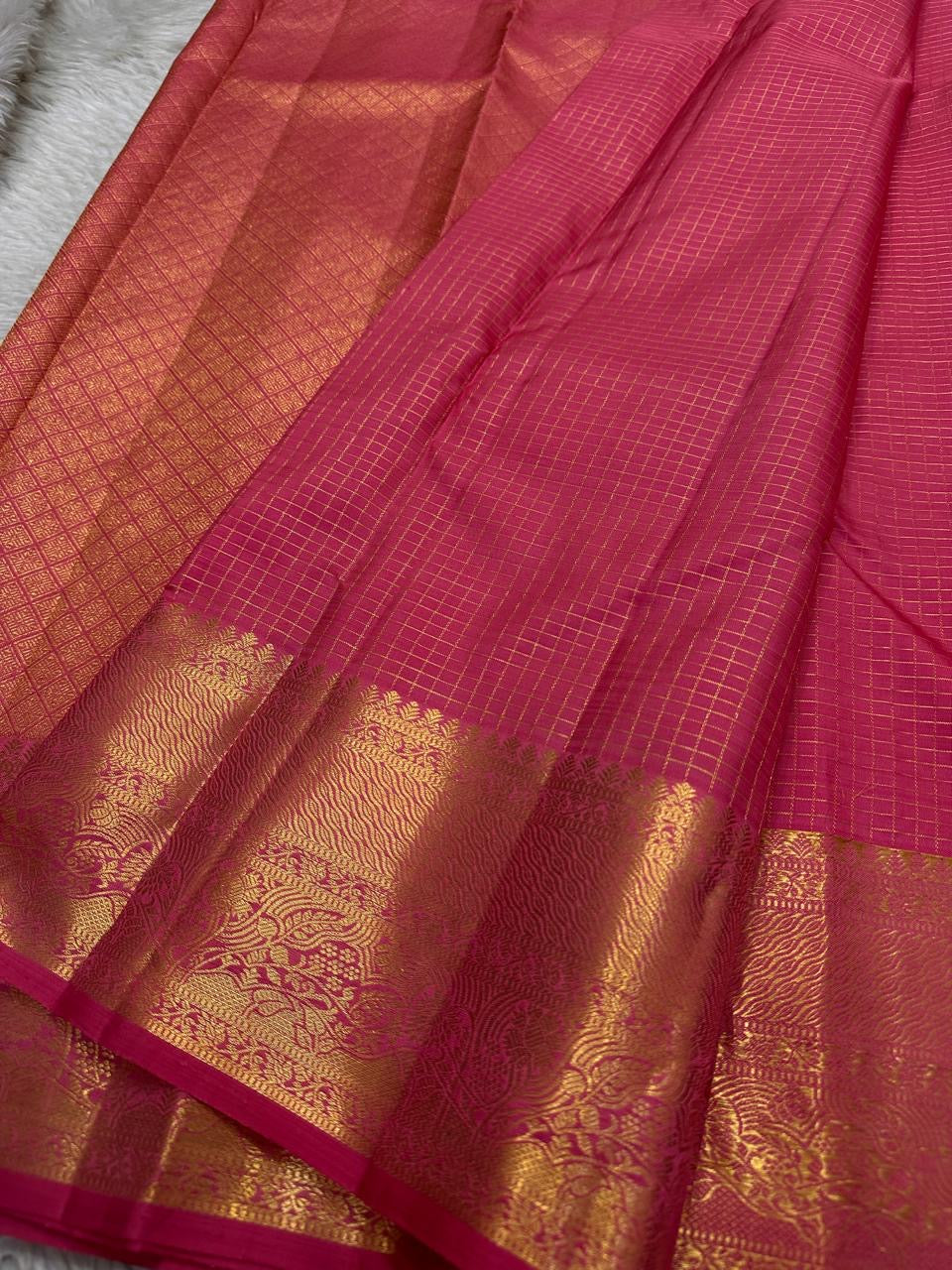 Handwoven pink Kanchipuram Zari Kattam saree with small antique-gold zari motifs.