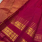 Antique-gold zari medallion butta woven across Pomegranate Pink Kanjivaram silk.