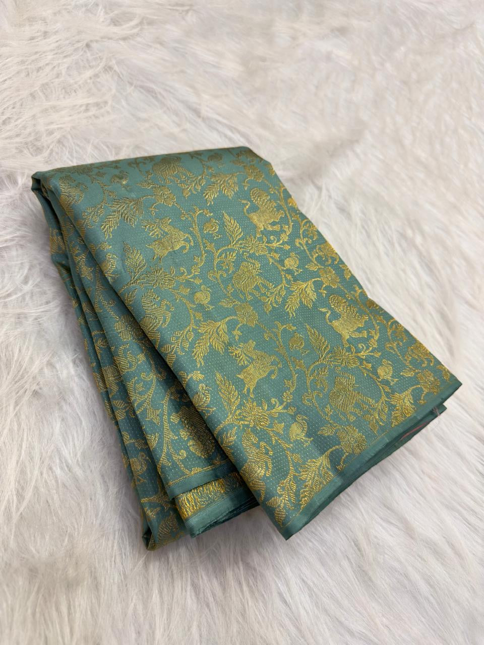 Aqua borderless pure silk Kancheepuram saree, folded view — Idam Living