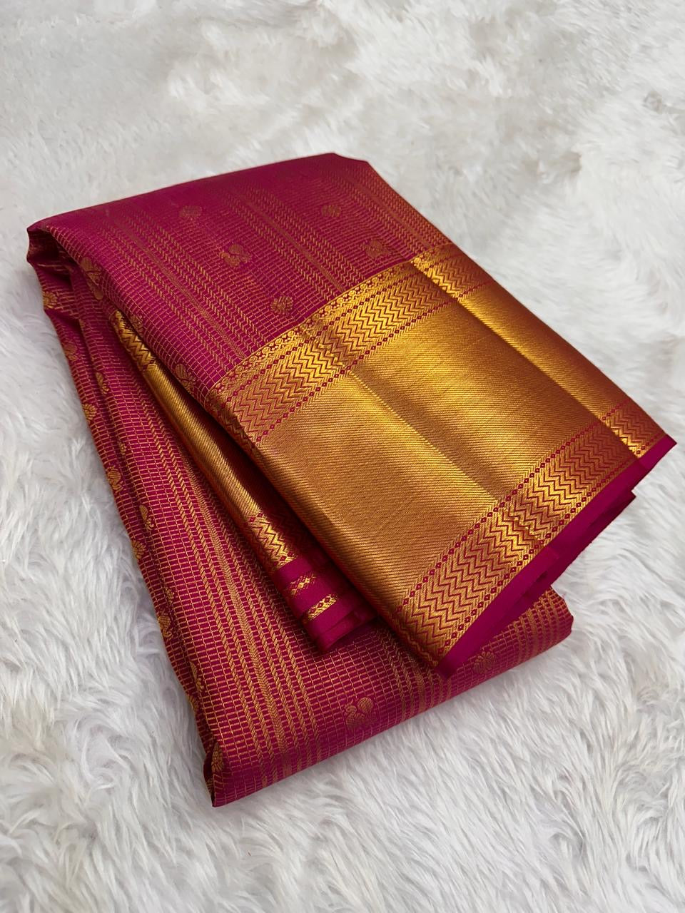 Raspberry pink handwoven pure silk Kanjeevaram saree with rows of petite gold zari buttas