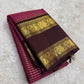Raspberry pink Kanchipuram silk saree with fine intersecting antique-gold Zari Kattam checks.