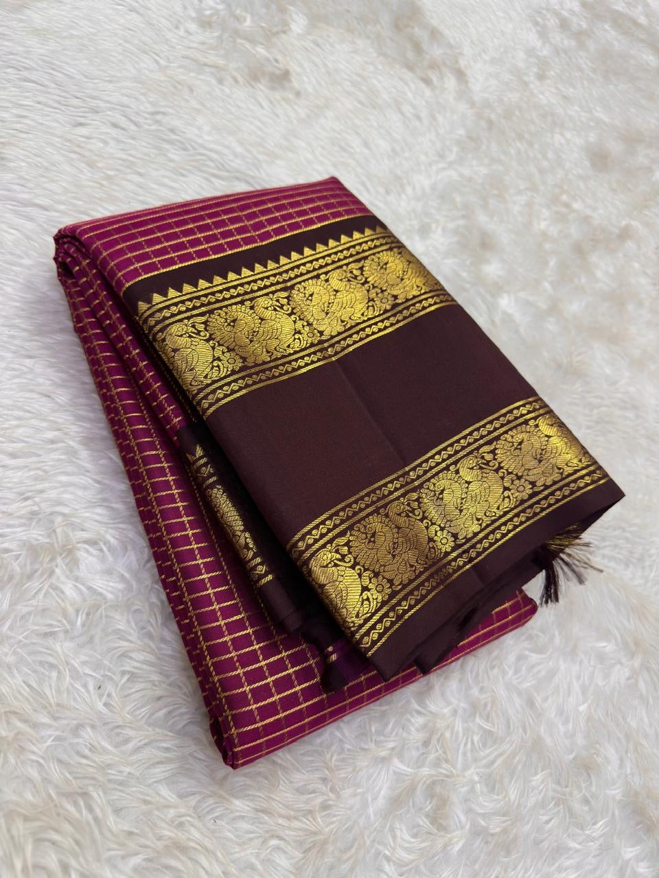 Raspberry pink Kanchipuram silk saree with fine intersecting antique-gold Zari Kattam checks.