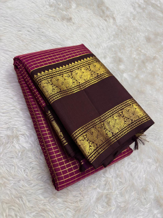 Raspberry pink Kanchipuram silk saree with fine intersecting antique-gold Zari Kattam checks.