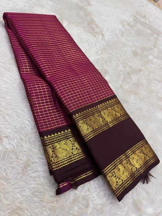 Raspberry Magenta pure silk Kanjivaram Zari Kattam saree with Deep Kanchana Brown and antique-gold Mayil border.