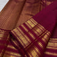 Raspberry maroon Kanchipuram silk saree with fine gold checked texture and layered Varisaipet border.