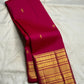 Rani Pink handwoven pure silk saree with small gold zari buttas and richly layered Varisaipet border.