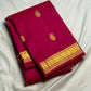 Close view of antique-gold zari buttas woven on Raspberry Pink Kanjivaram silk.