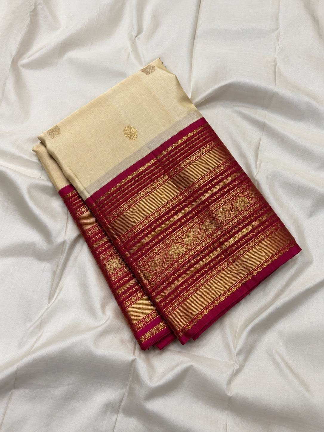 Bougainvillea pink contrast border with stacked antique gold zari bands on Korvai Kanchipuram saree