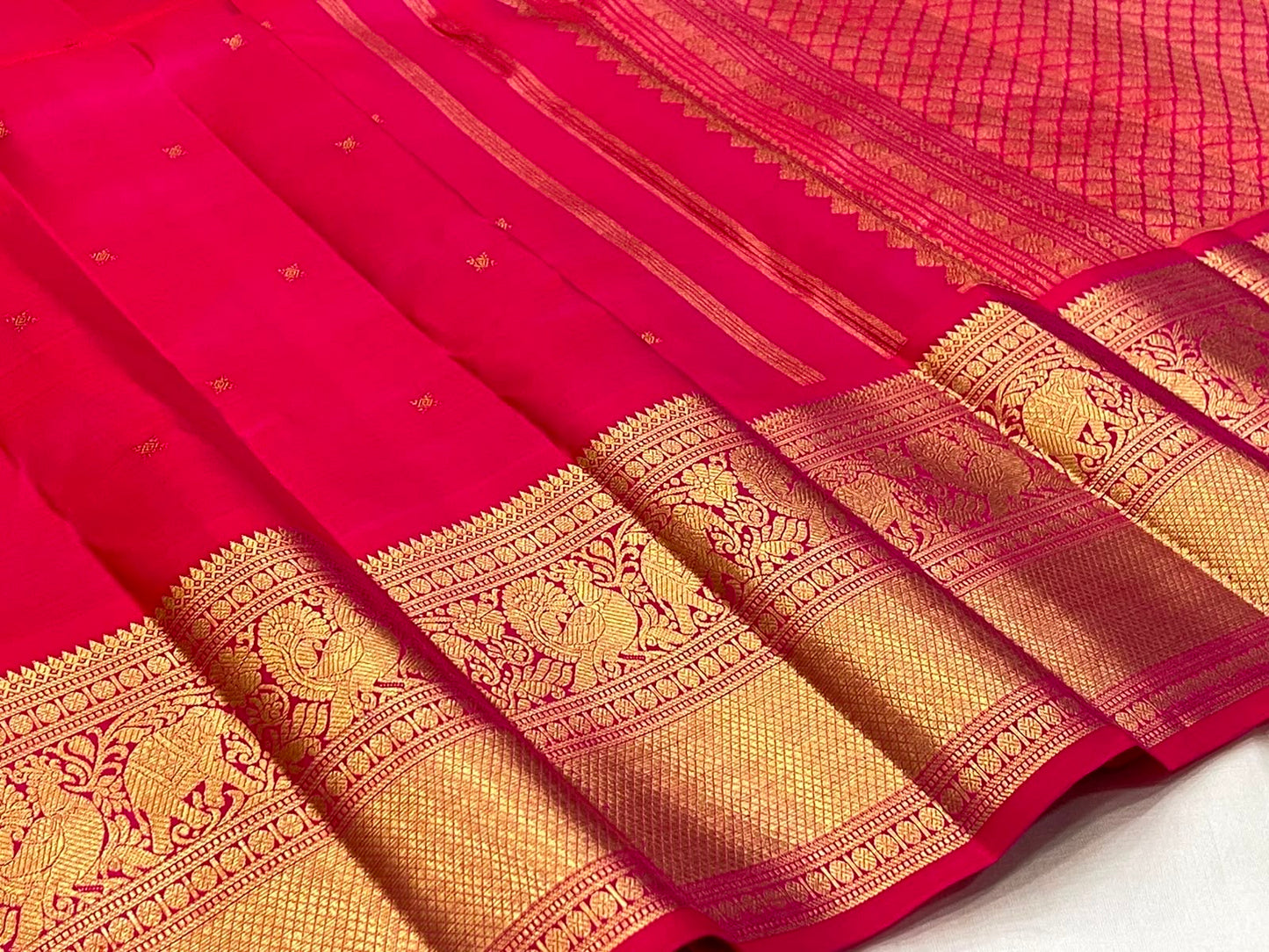 Raspberry Pink Kanchipuram Butta saree antique gold zari peacock border detail