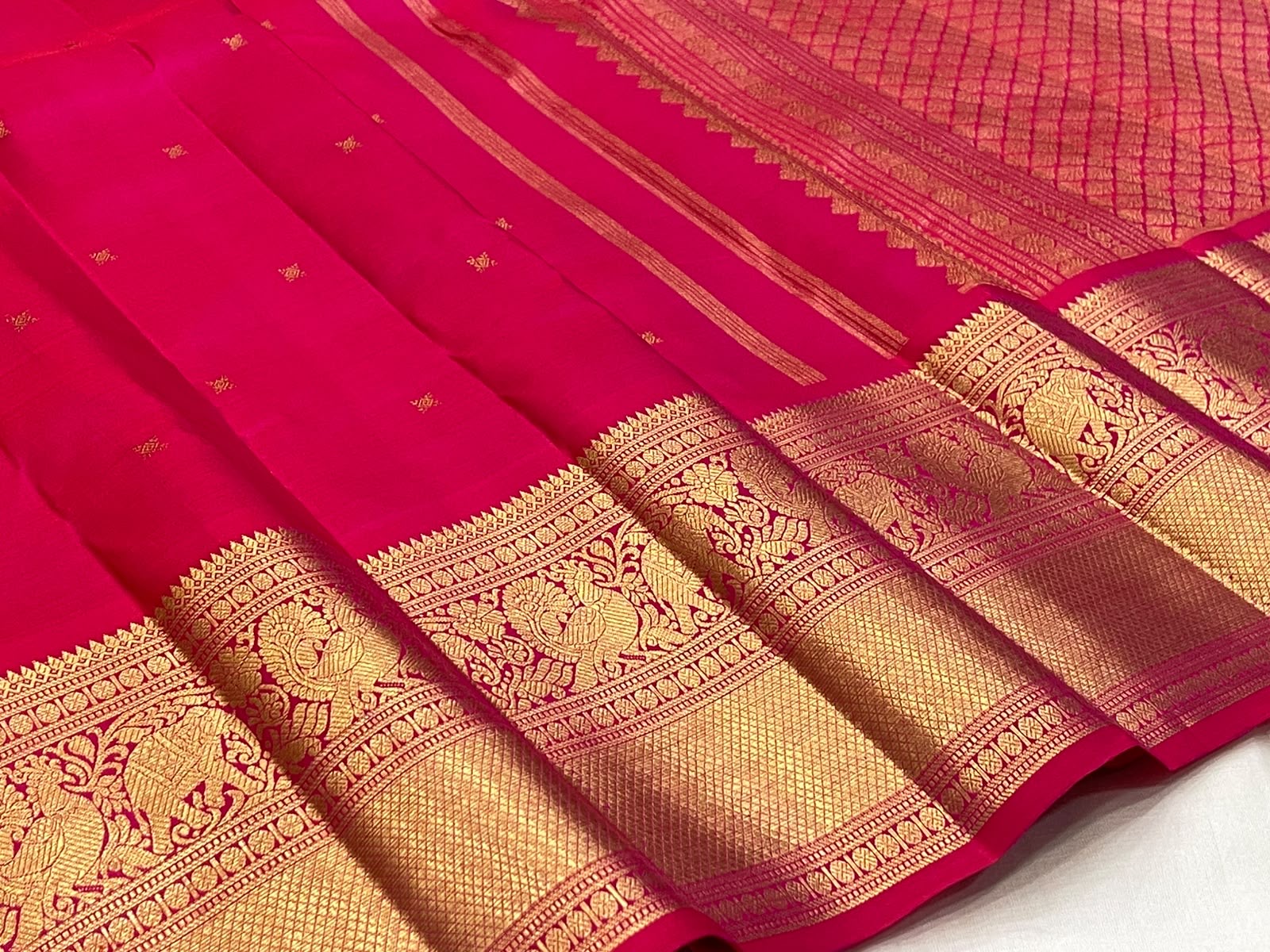 Raspberry Pink Kanchipuram Butta saree antique gold zari peacock border detail
