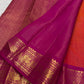Close view of handwoven gold zari buttas on orange Vairaoosi silk