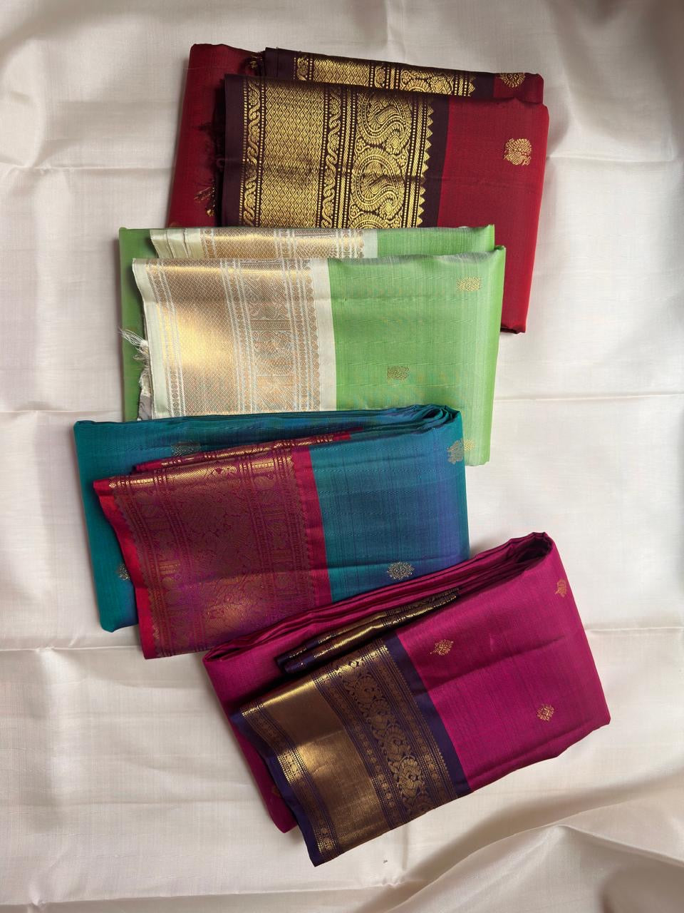 Deep Raspberry Kanjeevaram Saree — body close-up showing gold zari buttas