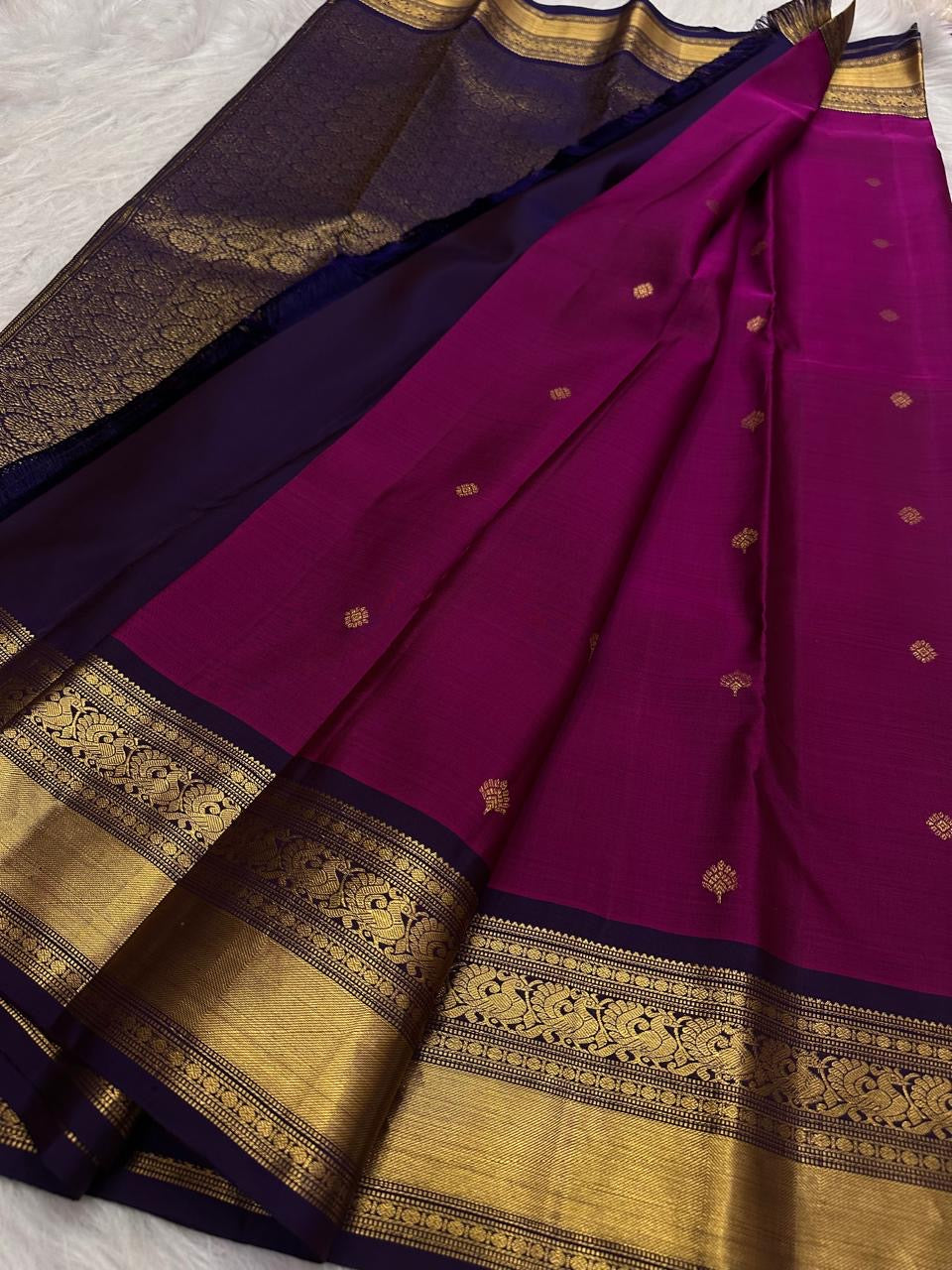 Deep Raspberry Kanjeevaram Saree — pallu detail with aubergine edging and gold zari peacock work