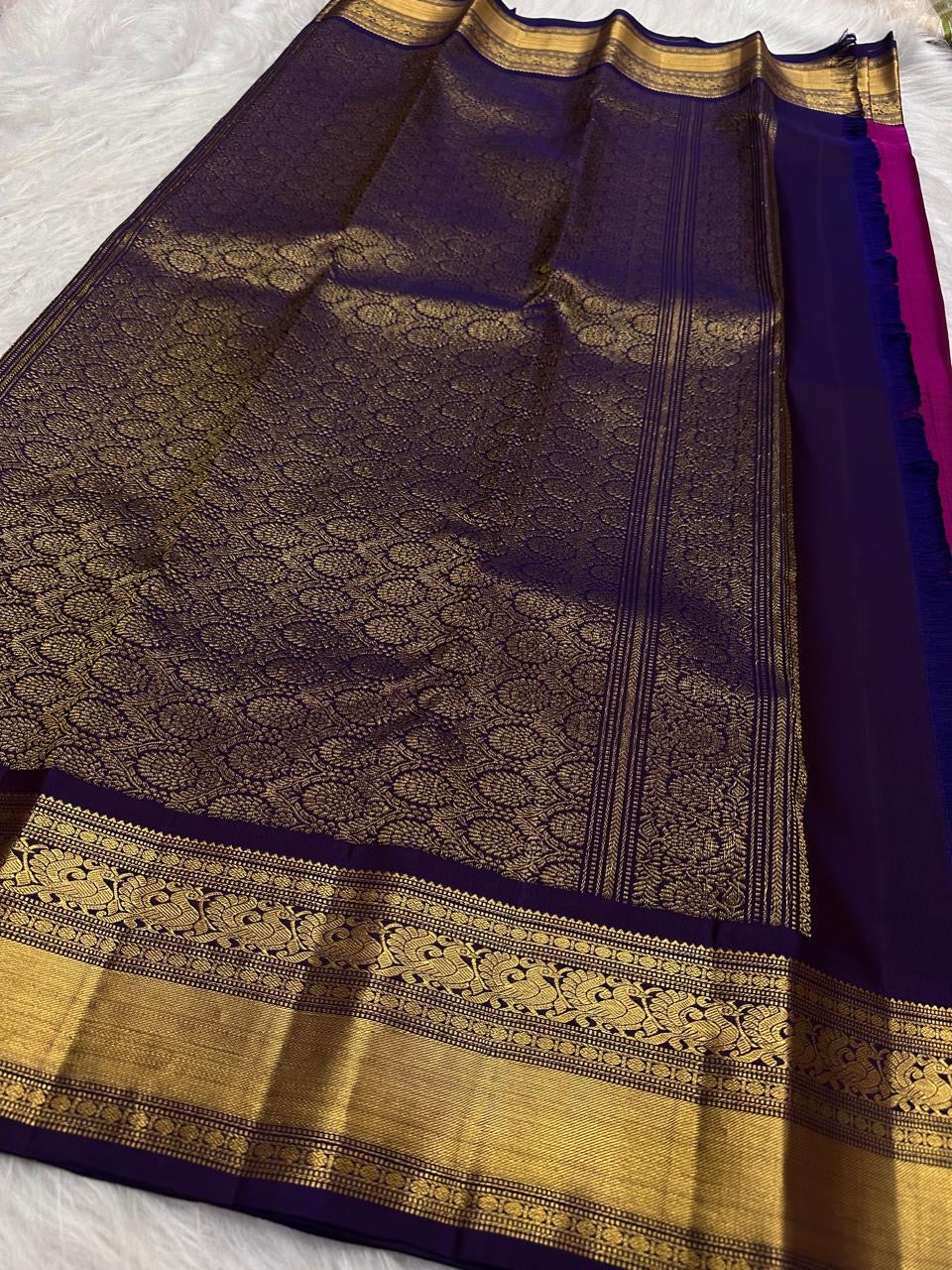 Deep Raspberry Kanjeevaram Saree — Korvai border with gold zari peacock and floral motifs, burnt-orange panel
