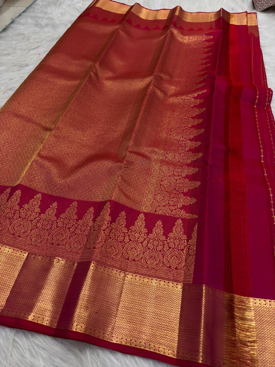 Raspberry Pink Kanjivaram silk saree with grand antique gold zari pallu