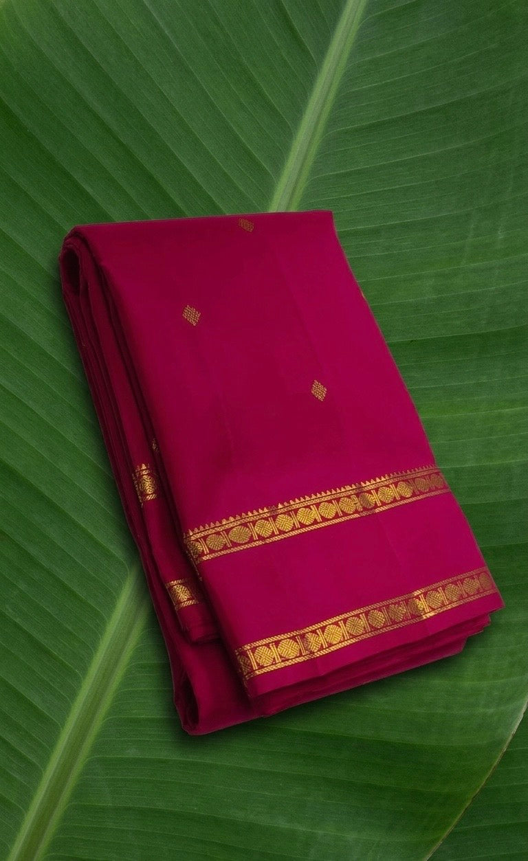 Raspberry pink Kanchipuram silk saree with traditional zari rettapet border – front view