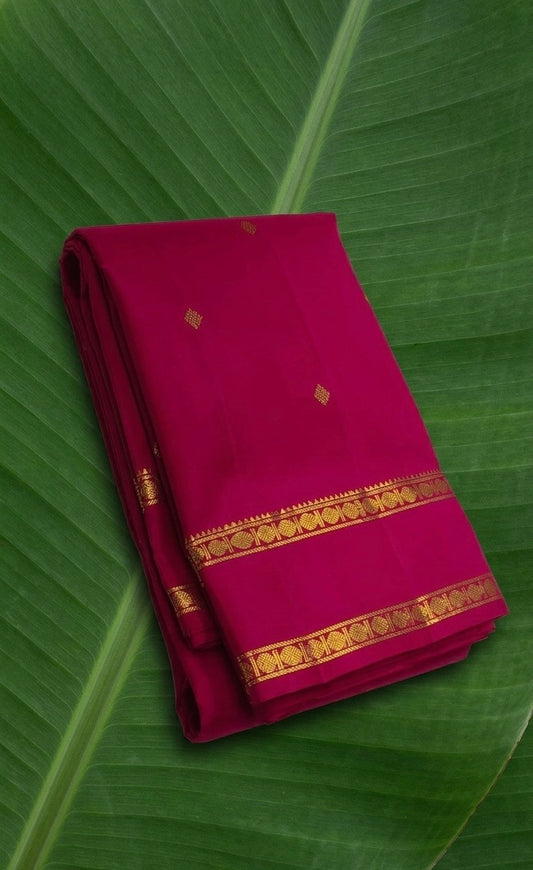 Raspberry pink Kanchipuram silk saree with traditional zari rettapet border – front view