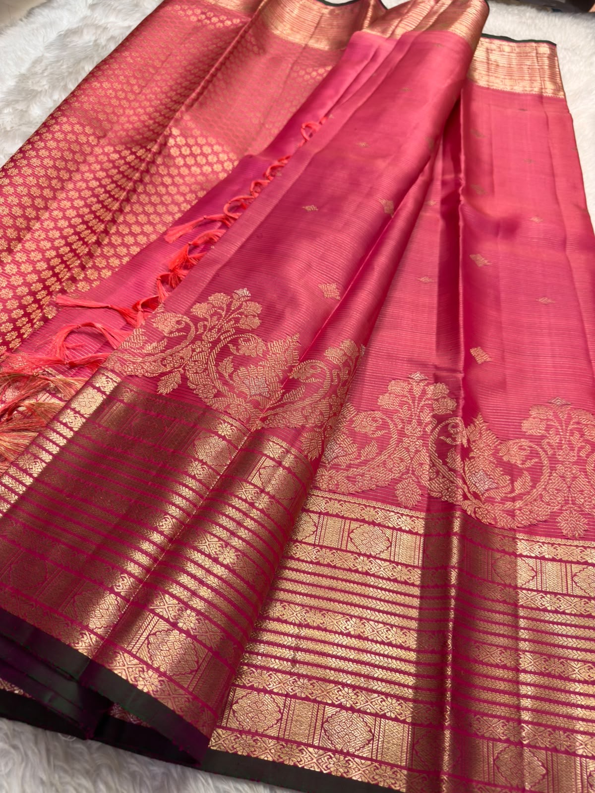 Double-tone pink Vairaoosi saree with warm orange radiance in the silk