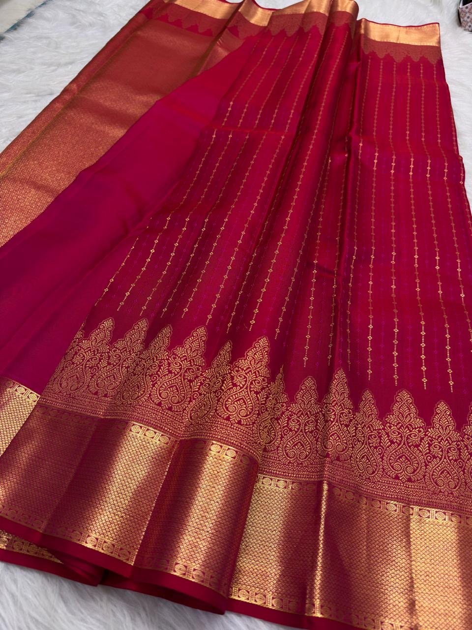 Pure Silk Kanchipuram Butta saree with broad traditional gold zari border