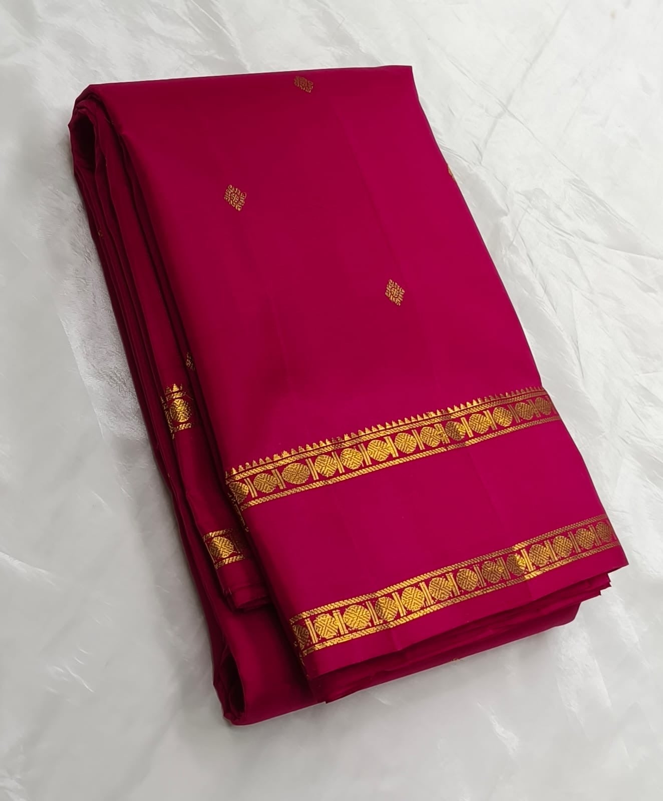 Raspberry pink Kanjivaram silk saree with gold zari butta detail