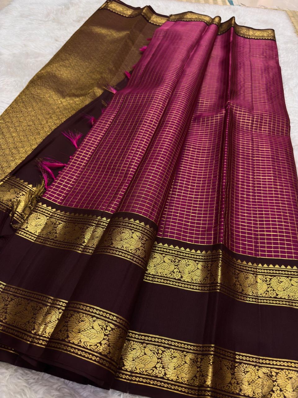 Deep Kanchana Brown Kanchipuram border with handwoven antique-gold Mayil motifs.