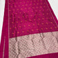 Raspberry Pink Pattu Silk Chanderi saree pallu with expansive metallic field and repeating scalloped floral pattern.