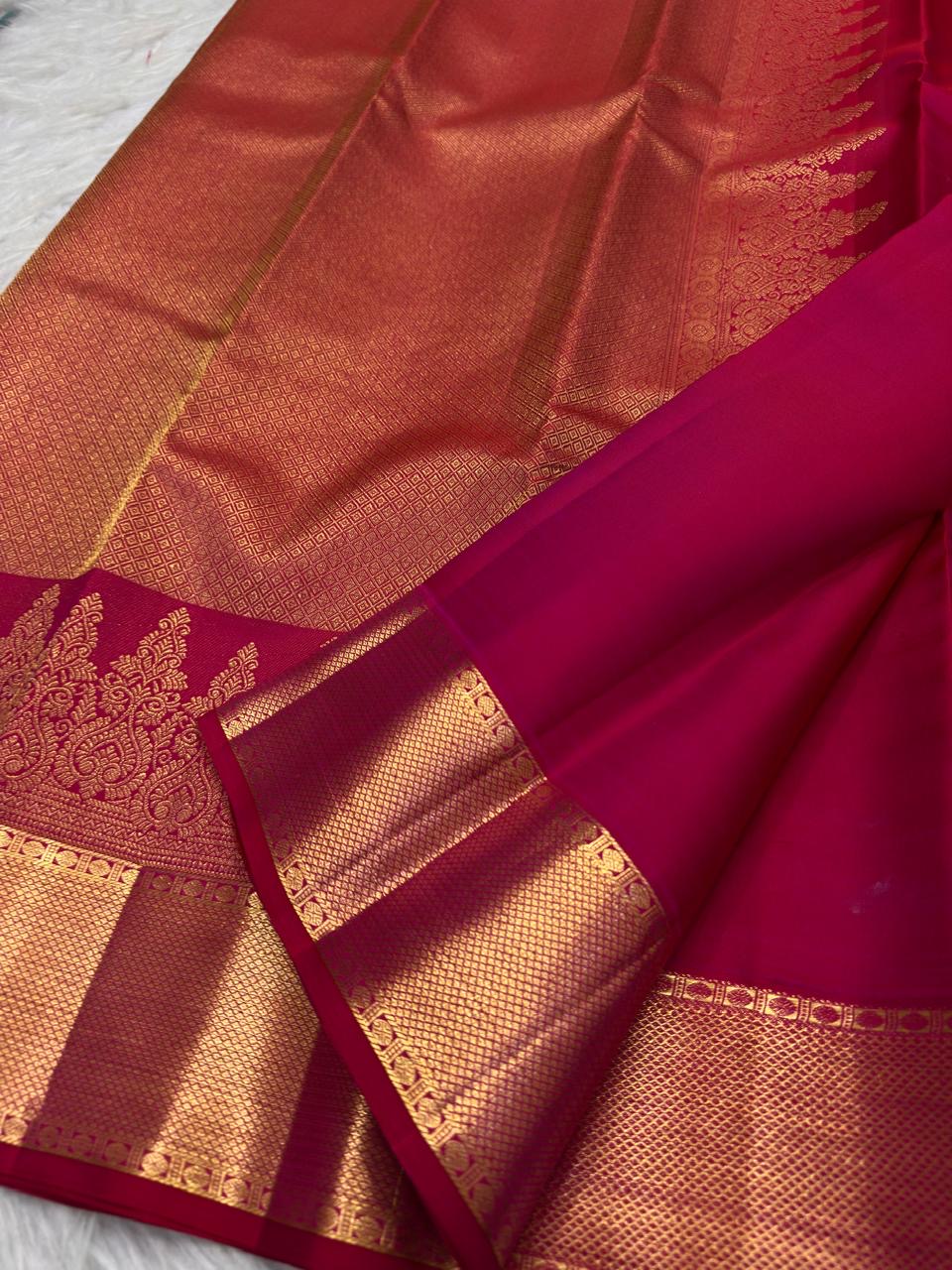 Raspberry Pink Kanjivaram saree with ornate antique gold zari paisley border