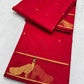 Raspberry red handloom Chanderi Katan Silk saree folded with gold zari border and woven floral accents
