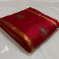 Full raspberry red Pattu Silk Chanderi saree with vertical gold zari lines and turquoise-and-gold floral woven accents