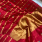 Raspberry red Pattu Silk Chanderi saree with broad gold-toned woven pallu and turquoise floral accents