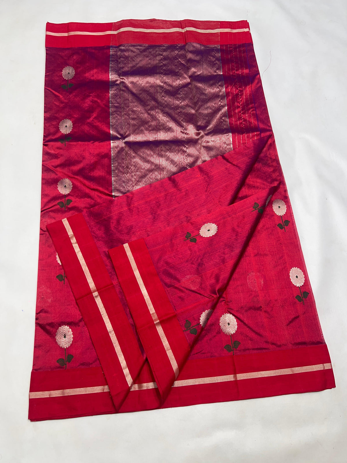 Raspberry Red handloom Pattu Silk Chanderi saree with silver floral buttas, green leaves and broad silver woven pallu