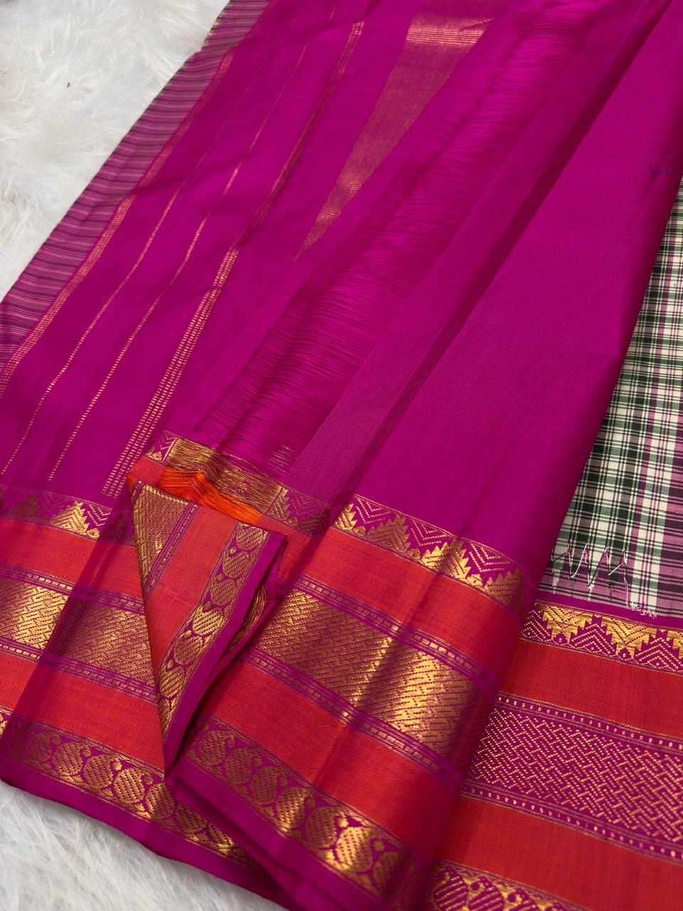 Raspberry-red Varisaipet border with geometric and ornamental gold zari detailing.