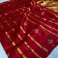 Raspberry red Chanderi silk saree showing gold-toned zari stripes, turquoise floral buttas and luminous woven pallu