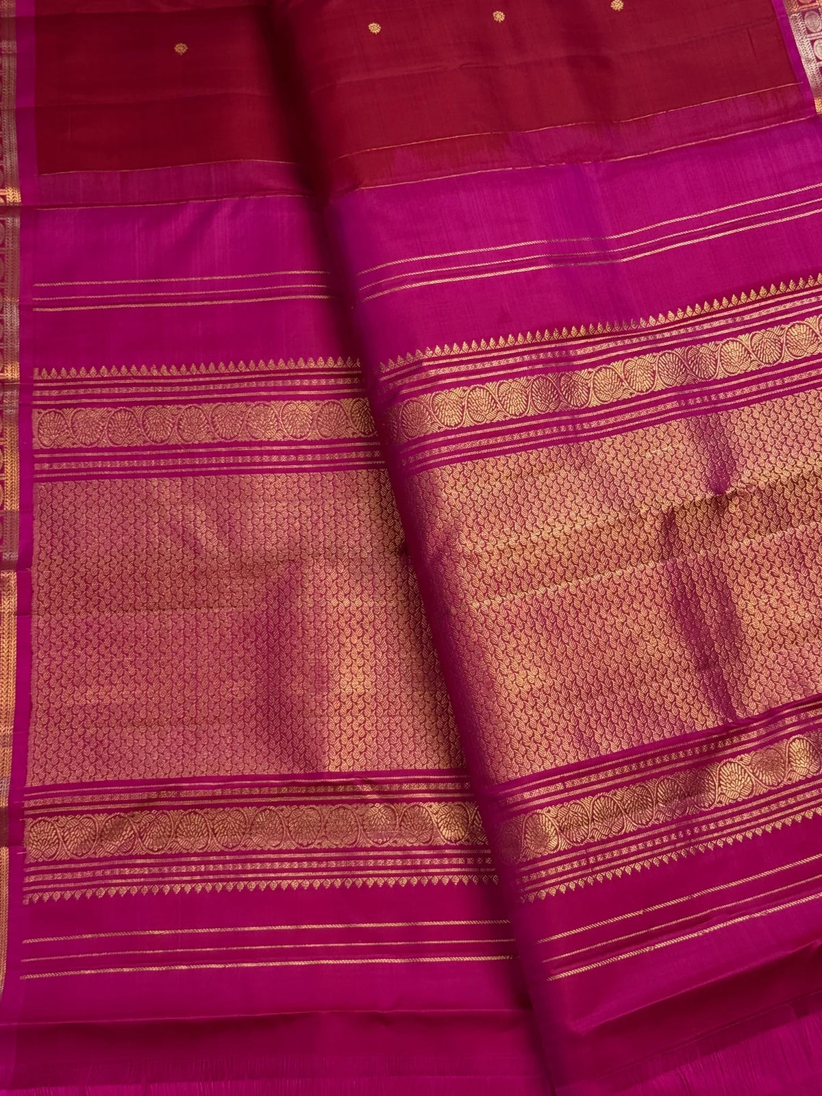 Raspberry red handwoven Kanjivaram butta saree with peacock teal border, detail