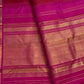Deep crimson handwoven Kanjeevaram butta saree with rani pink zari border, border detail