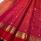Raspberry-red Pure Silk Kanchipuram saree showing the traditional gold Zari Kattam weave.