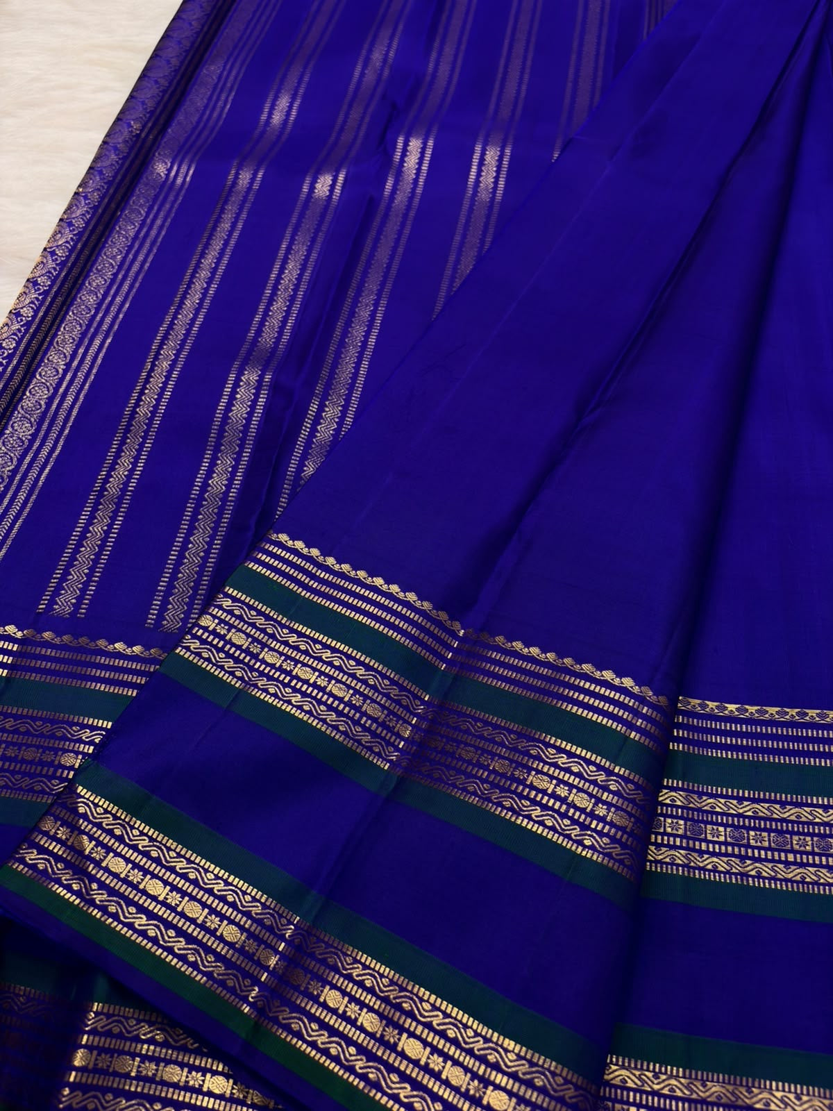 Radiant Neelam Blue Handwoven Pure Silk Kanchipuram Varisaipet Saree with Zari Mayil Chakram Buttas