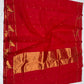 Folded raspberry red Chanderi silk saree showing gold buttas and woven peacock border