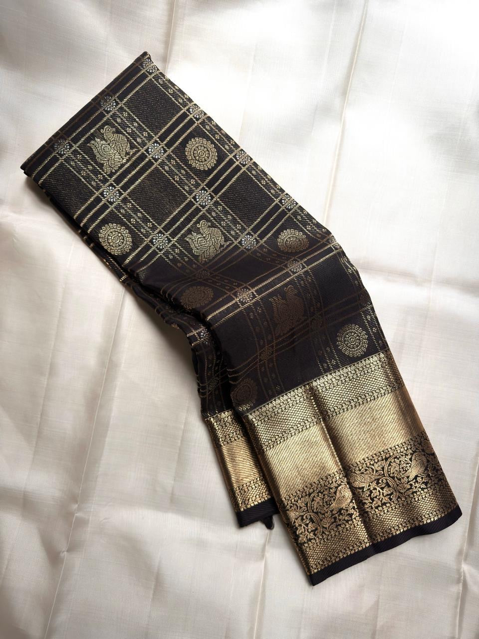 Raven Black Handwoven Pure Silk Kanjeevaram Saree with Zari Kattam and Antique Gold Peacock Border