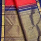 Deep neelam-blue pallu and border with Rudhraksham-inspired detailing on a deep vibrant red Kanchipuram silk saree.