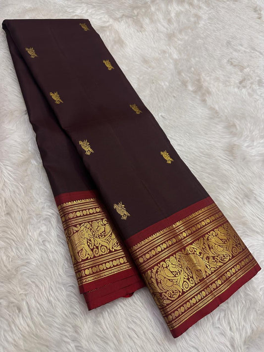 Deep maroon korvai border Kanchipattu saree – folded view