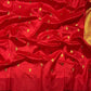 Crimson silk saree featuring silver flowers and leafy vines