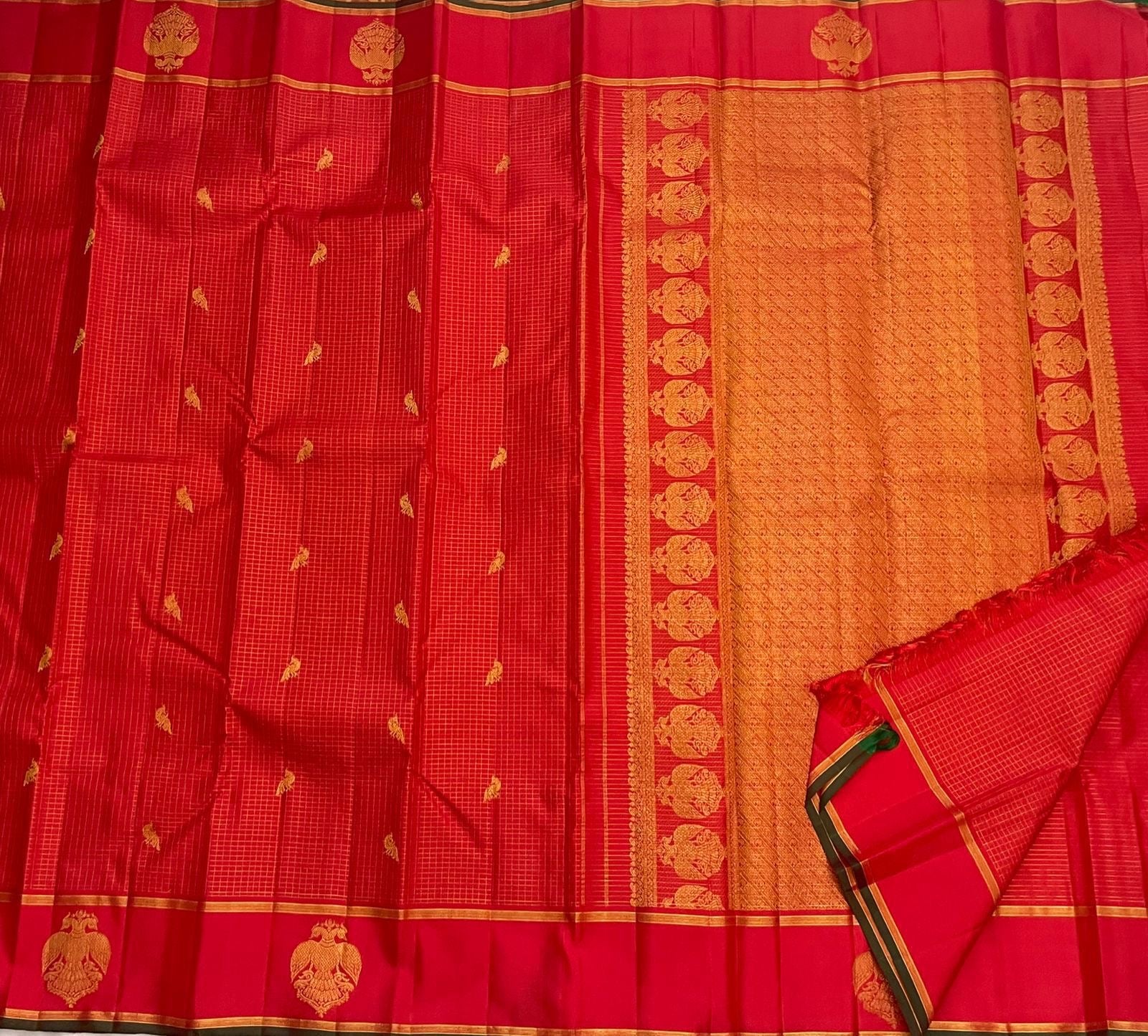 Red checked pure Kanchipuram silk saree border closeup with gold zari lines and green edge, shipped from New Jersey USA