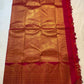 Open Red Deep Pink Pure Silk Kanchipuram saree showing richly woven gold zari pallu and ornate Vintage Turning Border.