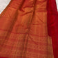 Red pallu with cascading antique gold zari motif array — floral, geometric, and medallion bands